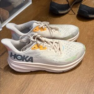 Hoka Cream and Orange Athletic Shoes